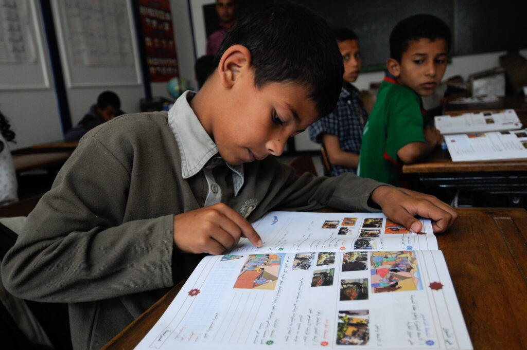 Boy reading in a school