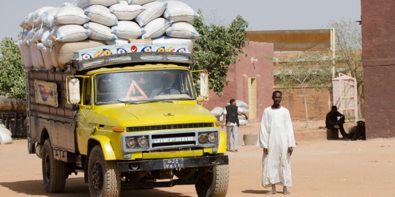 Truck loaded with sacks of grain in a market place in Sudan
